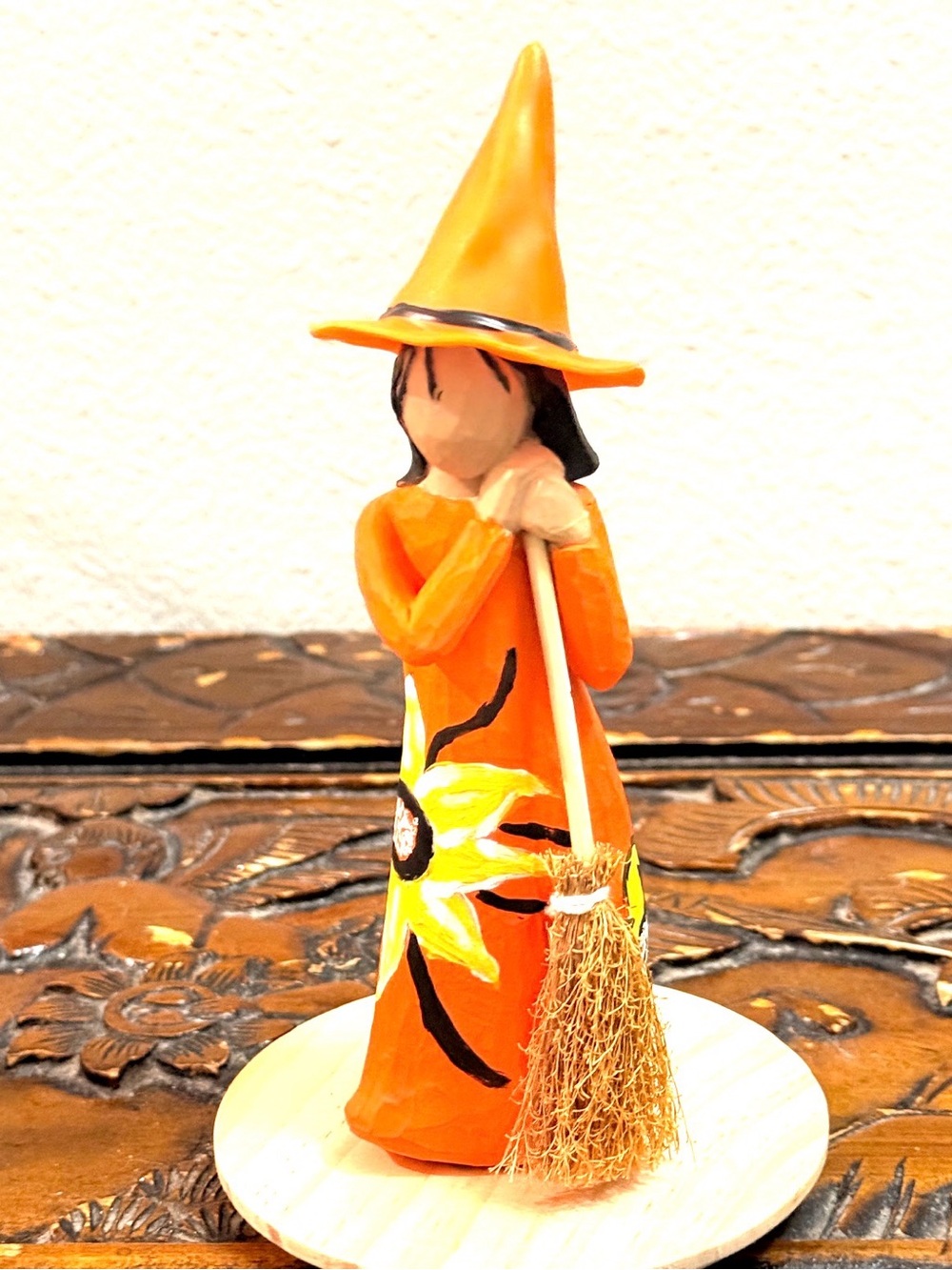 Sunflower Witch figurine with broom.